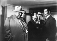 The corrupt Capt. Hank Quinlan (Orson Welles, left) faces off against honest Mexican cop Mike Vargas (Charlton Heston) in the legendary 17-minute single-take from Touch of Evil.