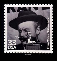 Citizen Kane, directed by and starring Orson Welles, is here commemorated on a postage stamp.  In this famous scene Kane gives a political speech with a giant portrait of himself in the background.