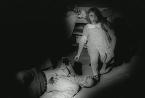 A young zombie and her victim, from Night of the Living Dead (1968)
