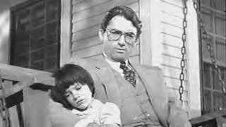 Gregory Peck as Atticus Finch and Mary Badham as Scout Finch